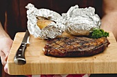 Grilled rump steak with baked potatoes