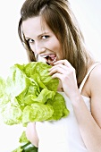 Young woman with lettuce