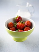 Fresh strawberries in a small bowl