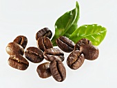 Roasted coffee beans with leaves