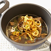 Meat stew with herbs and onions