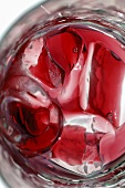 Red fruit juice with ice cubes