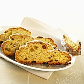 Three slices of Christmas stollen on a platter