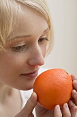 Young woman with orange