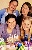 Four teenagers at birthday party