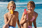 Boy and girl on holiday eating ice-cream