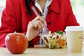 Woman eating salad