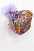 Heart-shaped, flower-patterned box with bow