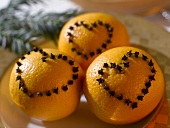 Oranges studded with cloves (heart shapes)