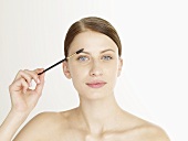 Woman with an eyebrow brush