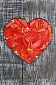 Flower petals in heart shape cut in wood