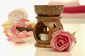 Aroma lamp, pink rose, towels and soap