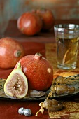 Pomegranates, figs and dates, glass of tea