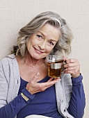 Mature woman with a glass of tea