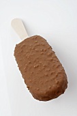 Chocolate-coated ice cream on a stick