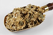 Dried chrysanthemum flowers in a scoop
