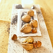 Hazelnuts, walnuts and poppy seeds with a glass of milk