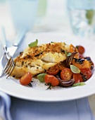 Cod with herb crust on tomatoes