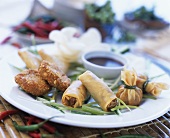 Assorted Asian snacks with soy sauce