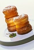 Doughnuts stacked with slices of orange