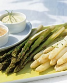Green and white asparagus with two different sauces