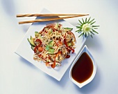 Asian rice noodle and vegetable salad with soy sauce