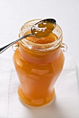 Apricot jam in jar with spoon