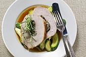 Loin of pork with herb stuffing on courgettes