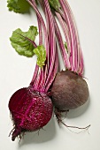 Beetroot with leaves, one halved, close-up