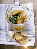 Pretzel soup with onions and deep-fried parsley