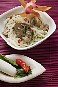 Rice noodles with pork fillet and chili peppers (Asia)