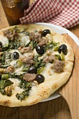 Pizza with tuna, chard and olives