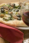 Pizza with tuna, chard and olives