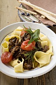 Ribbon pasta with braised oxtail, tomatoes, grissini