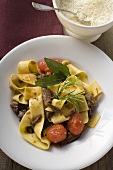 Ribbon pasta with braised oxtail, tomatoes and cheese