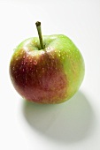 A fresh apple with drops of water