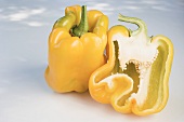 Yellow peppers, whole and halved