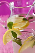 Lemonade with ice cubes and lemon balm