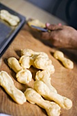 Eclairs on chopping board