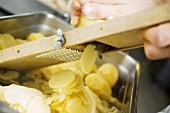 Slicer cooked potatoes with vegetable slicer