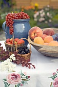 Summer fruit still life on table in garden