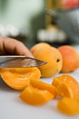 Cutting up apricots