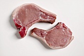 Two raw pork chops