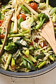 Orzo (rice-shaped pasta) with vegetables (overhead view)