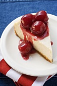Piece of cheesecake with cherries (USA)