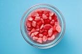 Small pink sweets in a jar (overhead view)