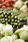 Courgettes, lettuces, cauliflowers & tomatoes at a market