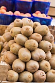 Kiwi fruits in a crate at a market