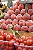 Tomatoes and peaches at a market