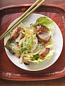 Lettuce with roast duck breast, vegetables, glass noodles (Asia)